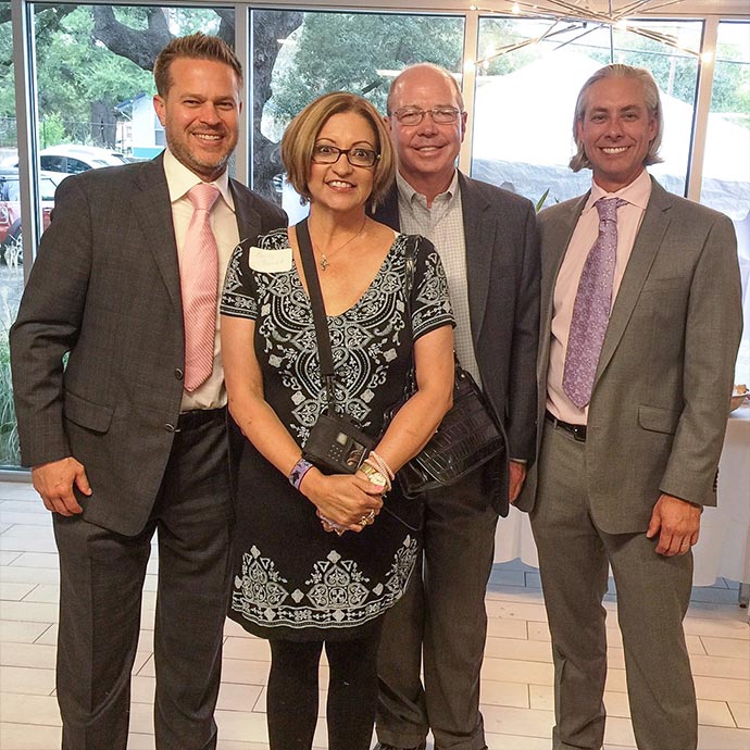 Dr. Robert Whitfield, Dr. Jack Walzel, and Dr. Ned Snyder with Breast Reconstruction patient at BRA Day