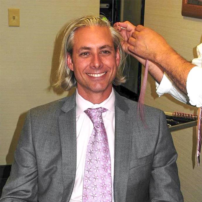 Dr. Ned Snyder getting a pink hair extension for his patients at BRA Day