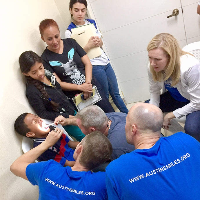 Drs. Kerr, Piazza, Crawford and Kelly evaluating a patient in Guatemala with Austin Smiles